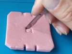 Cutting out to allow for the indentations in the base of the case