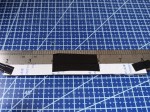 Taping the foam to the back of the ruler